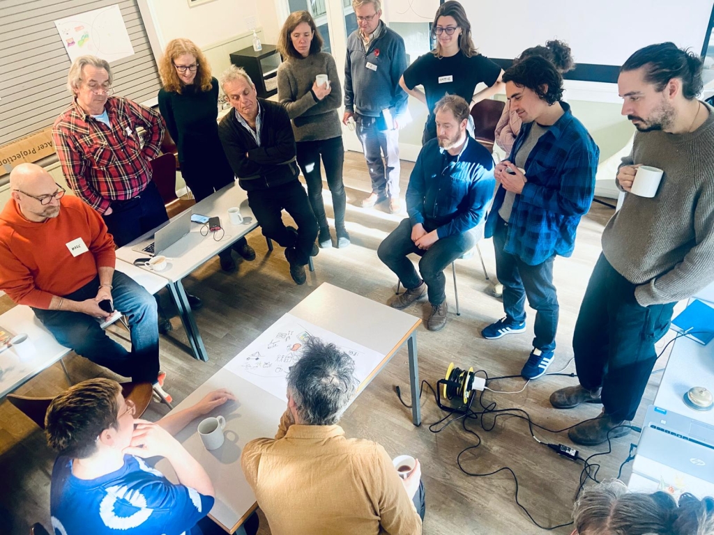 Group of people in a room discussing the future of grain