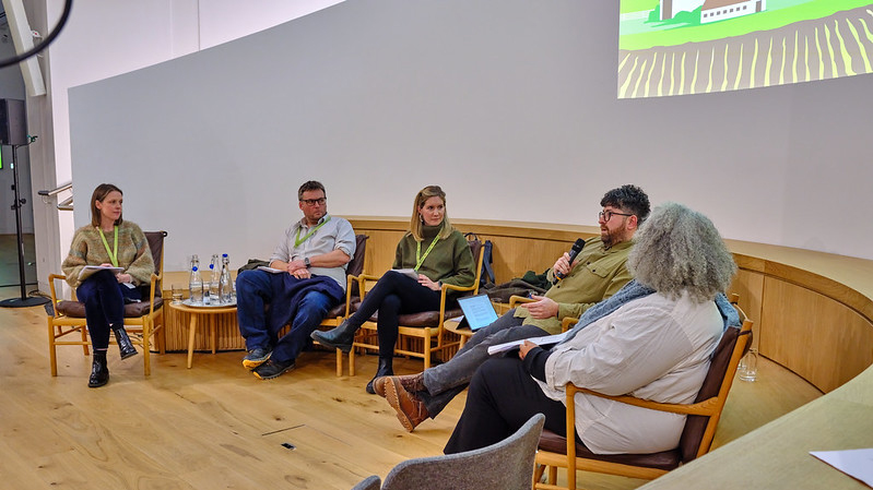 The panel sitting in a semi-circle