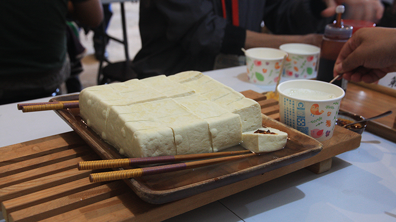 Tofu on table with condiments